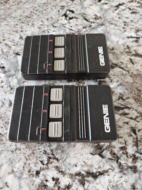 RARE VINTAGE PAIR OF GENIE GARAGE DOOR REMOTE CONTROLS WITH 3 BUTTONS, #GT90-3